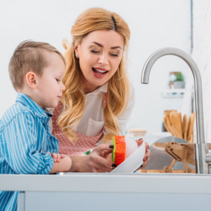 son doing dishes with mom
