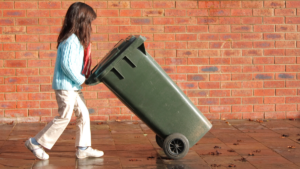 Girl taking out the trash